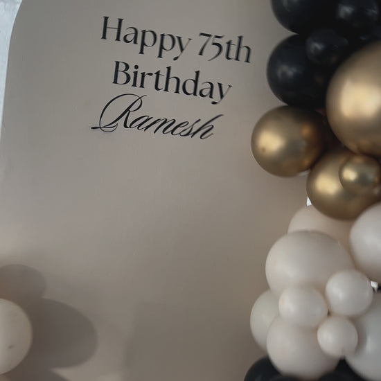 Birthday backdrop with black/sand/gold balloon garland Auckland 