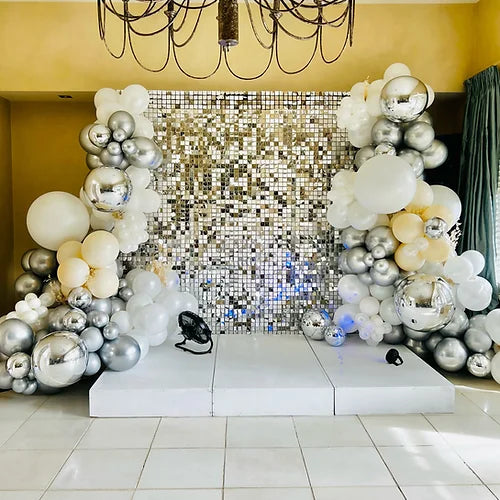 Silver Shimmer wall and a stage rental Balloon Balloonz   