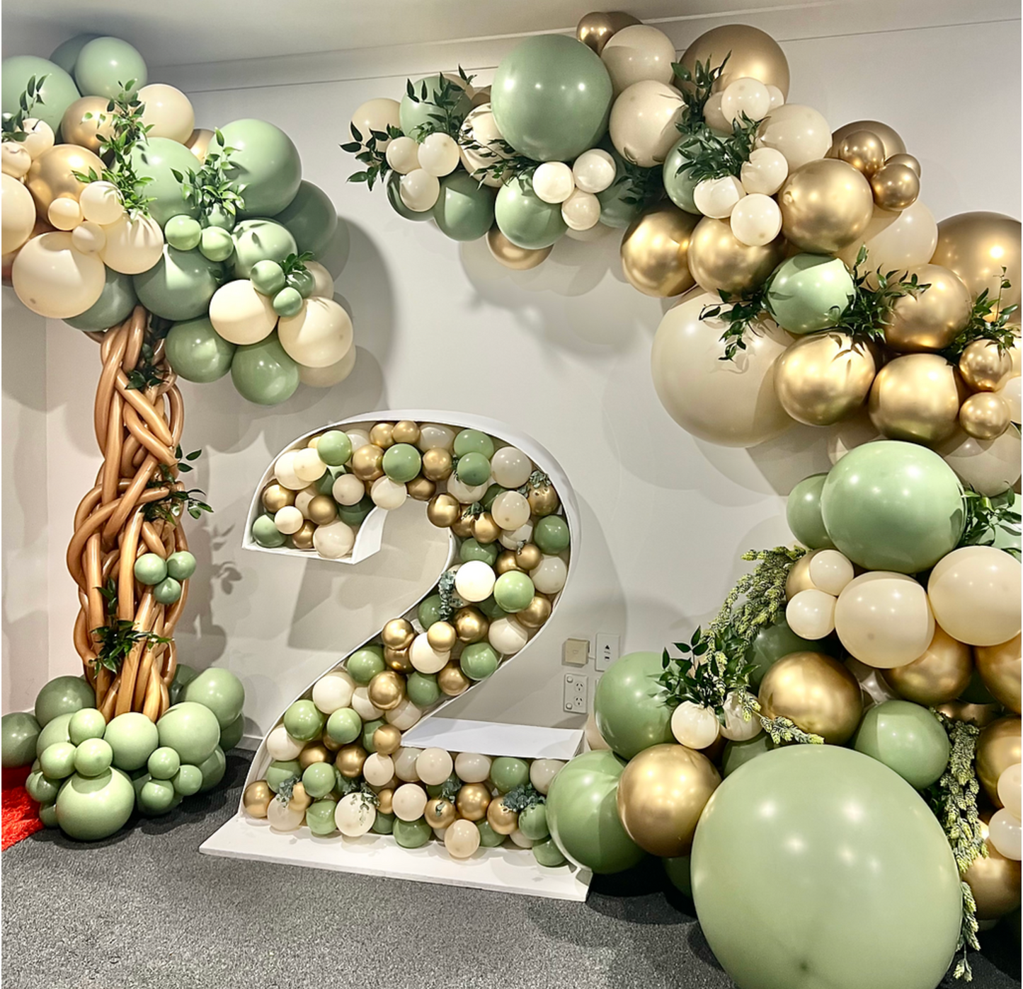 Jungle themed balloon garland and balloon mosaic number in sand and eucalyptus  Balloonz   